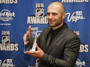 Calgary Flames' Mark Giordano holds the NHL Foundation Player Award after winning the award at the NHL Awards show, Wednesday, June 22, 2016, in Las Vegas.