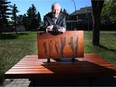 Brian Castle is still known as a hero in his community of Sunnyside since the flood of 2013. Castle is pictured with a bench, that is in memory of that time, in Calgary, Alta., on Wednesday June 15, 2016.