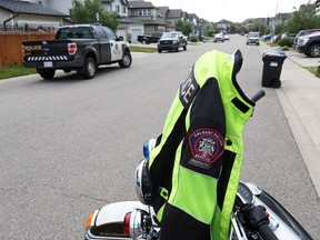 Police investigate at the scene where an approximately three year-old girl was struck and seriously injured in the 500 block of Auburn Bay Heights at about 6:45 Thursday morning June 30, 2016. The girl was hit by a vehicle as it pulled out of a drive-way. Gavin Young/Postmedia