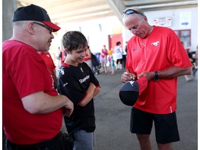 Calgary Stampeders general manager John Hufnagel signs autographs  before the Stampeders intrasquad mock game at McMahon Stadium in Calgary, Alta.. on Sunday June 5, 2016. Leah hennel/Postmedia