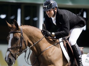 Eric Lamaze rides Melody des Hayettes to victory in the ATCO Challenge on day two of the Spruce Meadows National Thursday.