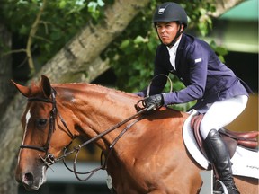 Kent Farrington of the USA rides Zafira during the Back on Track Cup Wednesday June 8, 2016 on the opening day of The National at Spruce Meadows. Hewon the Bantrel Cup later in the day.