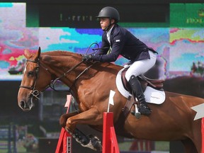 Kent Farrington of the USA rides Zafira during the Back on Track Cup Wednesday June 8, 2016 on the opening day of The National at Spruce Meadows. Hewon the Bantrel Cup later in the day.