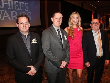 The four employees of a Crowfoot car dealership who came to the aid of a bleeding teen who had been badly assaulted in March 2016 pose at the annual Chief's Awards Gala Thursday evening June 2, 2016. Pictured from the left are Lee Copeland, James Latham, Julia Siemens and Paul Butler.