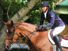 Kent Farrington of the USA rides Zafira during the Back on Track Cup Wednesday June 8, 2016 on the opening day of The National at Spruce Meadows. Hewon the Bantrel Cup later in the day. (Ted Rhodes/Postmedia)