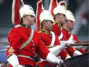 Lieutenant Erica Young of the Lord Strathcona Royal Canadians and her horse Shogun head up the honour guard during the awards ceremonies for the Encana U25 Cup at Spruce Meadows Friday June 10, 2016 on day three of The National. In addition to leading the military honour guard that performs at Spruce and takes part in all the awards ceremonies she is a Panzer tank commander.