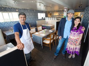 Nodir Mamadjanov poses with his wife Sitora and father Kamil inside the family's restaurant Begim, which is Calgary's first Uzbek restaurant.