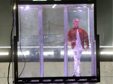 Justin Bieber brings his Purpose World Tour to Calgary at the Saddledome Monday June 13, 2016 beginning with his entrance in a glass cage held aloft.