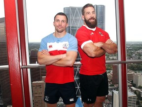 The captains of the Canadian and Russian rugby teams, Vasily Artemyev of Russia, left, and Jamie Cudmore of Canada, pose atop the Calgary Tower Tuesday June 14, 2016 to promote their upcoming match June 18 at the Calgary Rugby Park. (Ted Rhodes/Postmedia)