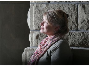 Author Pam Clark, a teacher at Connaught School in the Beltline, poses in front of the school's sandstone facade and columns Monday June 20, 2016. She has written her first book, called Kalyna, about Ukrainian internment camps in Banff.