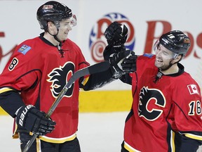 Calgary Flames Joe Colborne celebrates with teammate Josh Jooris after scoring against the St. Louis Blues during NHL hockey in Calgary, Alta., on Monday, March 14, 2016. AL CHAREST/POSTMEDIA