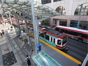 Commuters wait at the 4th Street S.W. CTrain station on Monday, May 16, 2016.