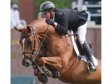 Canada's Eric Lamaze rides Check Picobello Z during the Back on Track Cup Wednesday June 8, 2016 on the opening day of The National at Spruce Meadows. Lamaze finished second in both Back on Track, on an earlier run, and earlier in the day, in the Erwin Hymer Group Cup.