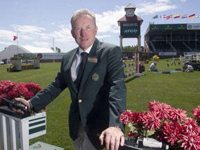 Spruce Meadows Competitions Manager Jon Garner oversees conditions from his post in the International Ring Thursday June 9, 2016 during The National at Spruce Meadows. Heavy winds and rain had ripped through the grounds the previous day.