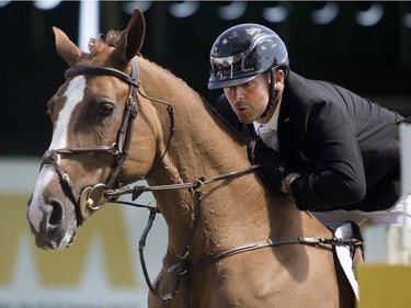 Canadian Eric Lamaze rides to victory in the ATCO Challenge on day two of the Spruce Meadows National Thursday June 9, 2016.