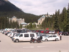 Cars circle around to find available parking outside of the Fairmont Chateau Lake Louise on June 28, 2016.