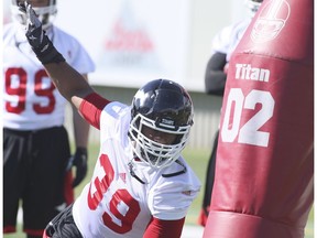 Charleston Hughes (39) works on a blocking drill at the opening session of training camp for the Calgary Stampeders in Calgary, Sunday, May 29, 2016.