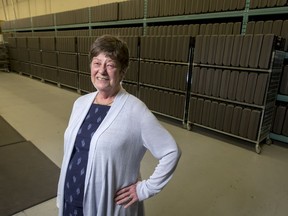 Barb Clifford stands with rows of voting compartments at the city's Election and Information Services in Calgary, Alta., on Wednesday, June 1, 2016. Clifford has announced her retirement as the city's Chief Electoral Officer.