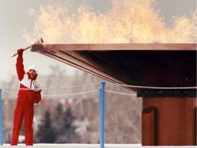 Robyn Perry lights the Olympic cauldron during the opening ceremonies of the 1988 Calgary winter Olympics.  File photo