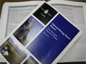 Copies of the National Energy Board report on the Trans Mountain pipeline expansion project, which a new Angus Reid Institute poll shows is the source of division between B.C. and Alberta.