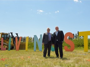 Councillor Jim Stevenson and Alan Norris, president and CEO of Brookfield Residential, are seen on the site of future homes in the new community of Livingston in Calgary on June 22, 2016.