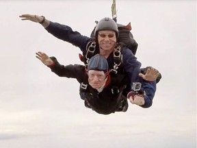 Dave Clarke, chief instructor with Alberta Skydivers, tandem skydives with 94-year-old Doug Curtis near Beiseker, Alta north of Calgary, Alta on Wednesday, June 8, 2016. Curtis celebrated his 94th birthday with his first ever skydive jump. Courtesy Alberta Skydivers/Postmedia