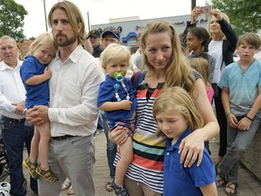 David Stephan and Collete Stephan, make a statement to  supporters outside the courthouse in Lethbridge, Alberta, Friday, June 24, 2016.   The couple were convicted in April in the 2012 death of their son 19-month-old Ezekiel.