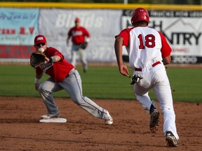 Aryn Toombs/Calgary Herald OKOTOKS, AB -- August 6, 2015 -- Okotoks Dawgs infielder Kellen Marruffo isn't fast enough to steal second at Seaman Stadium in Okotoks on Thursday, Aug. 6, 2015. The Okotoks Dawgs played the Medicine Hat Mavericks in game five of a five game series to determine which team will continue on in Western Major League Baseball playoffs. (Aryn Toombs/Calgary Herald) (For SPORTS story by NONE) 00067488A SLUG: 0806 Dawgs vs. Medicine Hat G5