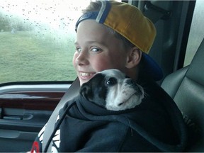 Finn Safir, 10, of Whitefish, Mont., and his family are desperately looking for their 3.5-month-old female Boston Terrier, Danger. She was inside the family's truck when the vehicle was stolen outside the Country Inn and Suites in Calgary between June 2 and June 3, 2016.