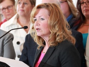 Calgary Public Board Chair Joy Bowen-Eyre speaks to the media backed by fellow the provincial school trustees on April 20, 2015.