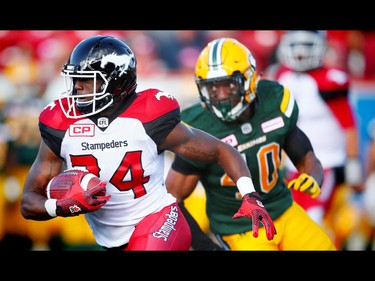 Calgary Stampeders Tory Harrison avoids a tackle by Deon Lacey of the Edmonton Eskimos in CFL football in Calgary, Alta. on Saturday June 11, 2016. Al Charest/Calgary Sun/Postmedia Network