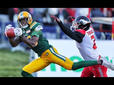 Edmonton Eskimos  Bryant Mitchell with a touchdown catch in front of Adam Thibault of the Calgary Stampeders in CFL football in Calgary, Alta. on Saturday June 11, 2016. Al Charest/Calgary Sun/Postmedia Network