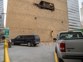 Bricks crumbled from the wall of the Genco building on 7th Street S.W. in May 2014.