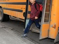 Gavin Young, Calgary Herald CALGARY, AB: SEPTEMBER 02, 2014 -- Kids arrive by bus on the first day of school at St Thomas Aquinas  Elementary School in Glamorgan on Tuesday September 2, 2014. Gavin Young/Calgary Herald (For City section story by TBA) Trax# 00058419A