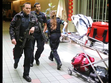 Police and emergency workers deal with a stabbing incident in the Perpetual Wellness Chinese Medicine Centre on Thursday June 16, 2016