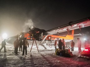In this photo provided by the National Science Foundation, a small plane picks up a sick worker at the U.S. South Pole science station.