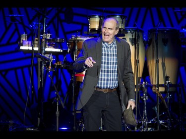 James Taylor walks on stage to perform at the Scotiabank Saddledome in Calgary, Alta., on Wednesday, June 8, 2016. Lyle Aspinall/Postmedia Network