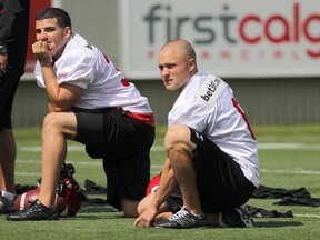 Calgary Stampeders Rene Paredes, left and Rob Maver during a July 2013 Stamps practice at McMahon Stadium in Calgary.