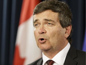 Alberta's Minister of Agriculture and Forestry Oneil Carlier speaks about the dismissal of the board of directors of the Agriculture Financial Services Corportation during a press conference at the Alberta Legislature in Edmonton, Alta., on Monday June 13, 2016.