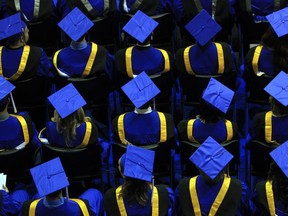 Stuart Gradon/Calgary Herald  CALGARY, AB: JUNE 6, 2013 - Graduating students at the Mount Royal University spring convocation ceremony at the university in Calgary, Alberta Thursday, June 6, 2013.   (Stuart Gradon/Calgary Herald)  (For City story by David Fraser) 00045873A