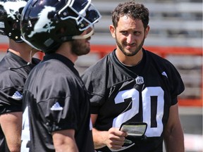 New Calgary Stampeders quarterback G.J. Kinne right talks with fellow quarterbacks during practise on Monday June 13, 2016. Gavin Young/Postmedia