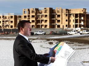 Chris Elkey, Senior Director Real Estate at Canada Lands Company, looks over a site plan for Currie development. Currie won an award for Charter Award for Neighbourhood, District, and Corridor by the Chicago-based Congress of New Urbanism.