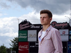 Christina Ryan/ Calgary Herald OKOTOKS, Alberta --JULY 1, 2000 -- Peter Hutzal with the Midget Dawgs poses on the baseball field in Okotoks, on July 14, 2015. (Christina Ryan/Calgary Herald) (For {sup 1} story by {cart}) 00066903A SLUG: 0715 Midget Dawgs 4