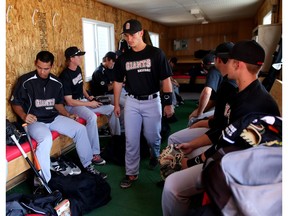 The Fort McMurray Giants get ready in the visitors clubhouse before taking on the Okotoks Dawgs at Seaman Stadium in Okotoks, Alta., on Friday June 3, 2016.