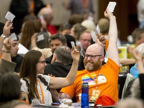 Party faithful hold their ballots during a vote at the Alberta NDP convention in Calgary, Alta., on Sunday, June 12, 2016. Lyle Aspinall/Postmedia Network