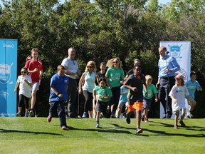 Runners take part in a short fun run down the 10th fairway at Canyon Meadows Golf and Country Club on Monday June 27, 2016. The event was to announce the addition of a fundraising Birdies for Kids Champions Run at the Shaw Classic. The 5km run on Sept. 5th will also feature PGA Champions Tour golfer Scott McCarron and his wife Jenny joining the runners. Gavin Young/Postmedia