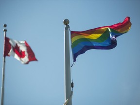 Canadian flag and a Pride flag.