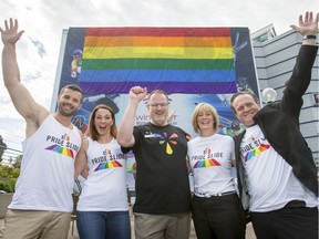 (L-R) Pride Slide ambassador and openly gay bobsleigh athlete Simon Dunn, Olympic silver medallist (bobsleigh) Helen Upperton, Calgary Pride president Stephen Wright, WinSport VP and general counsel Kim Jones and WinSport president and CEO Barry Heck pose for a photo at Canada Olympic Park in Calgary, Alta., on Thursday, June 23, 2016. Winsport announced its Pride Slide, an 810-foot wet slide attraction set for Aug. 27 that will be part of a kick-off to the city's 26th annual Pride Week.