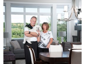 Ron and Maureen Cherkas with their dog Murphy in their villa by Calbridge Homes in Riverstone of Cranston.
