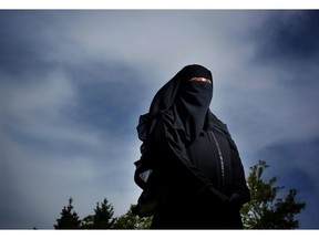 Shima Safwat in Calgary, Alta., on Thursday June 16, 2016, helps promote understanding about why she chooses to wear the Niqab. Leah Hennel/Postmedia